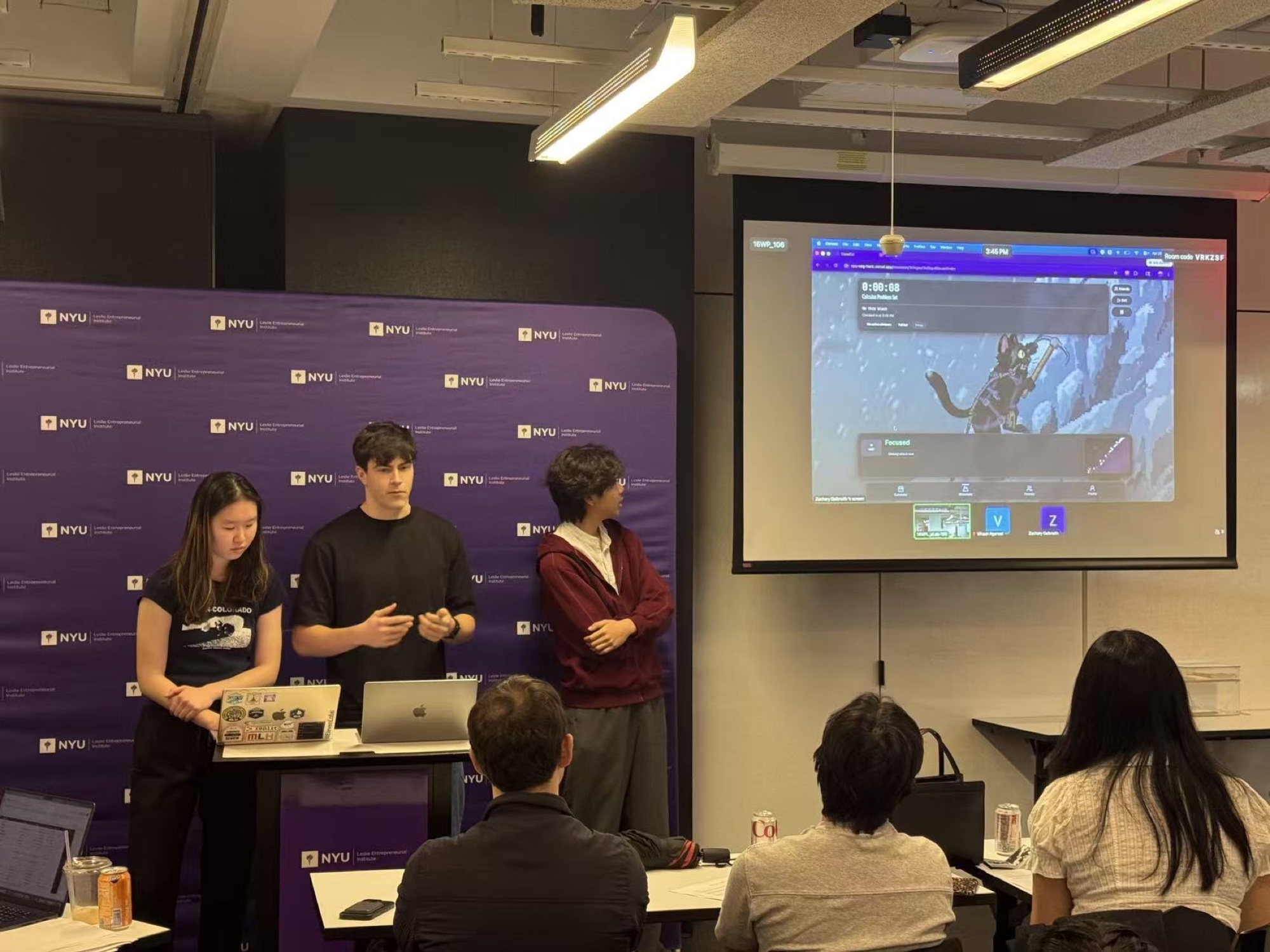 A team presenting a project to an audience